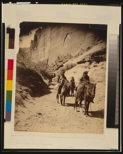 Band of mounted Navahos passing through Cañon, 1904
