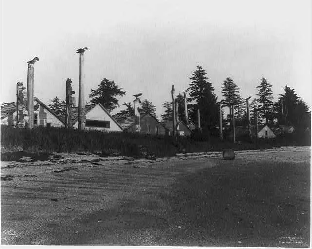 [13 totem poles in front of houses in Alaska or the Aleutian Islands], 1899