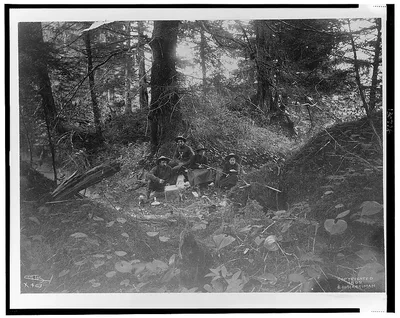 [Two men and two women seated in forest in Alaska, 1899]
