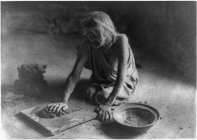The potter mixing clay, 1921