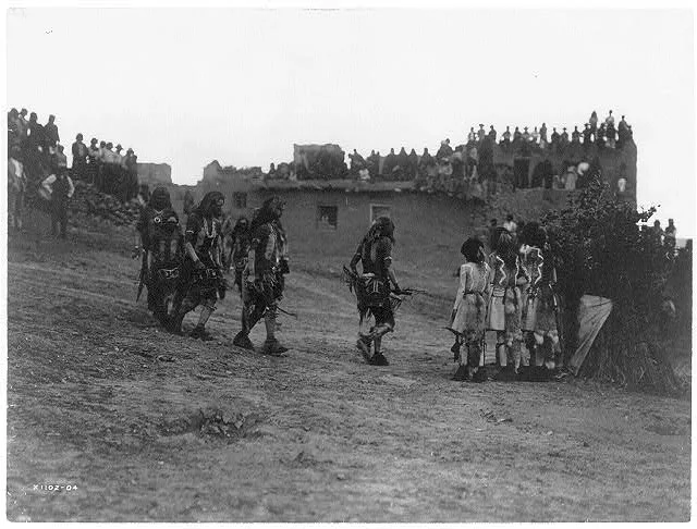 Snake dancers entering the plaza, Arizona, 1905