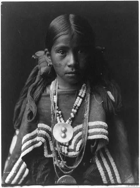Jicarilla girl in feast dress, 1905