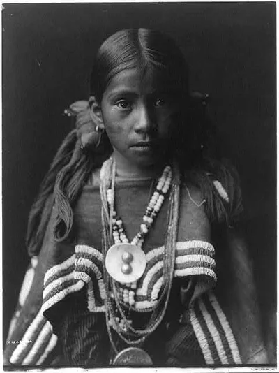 Jicarilla girl in feast dress, 1905