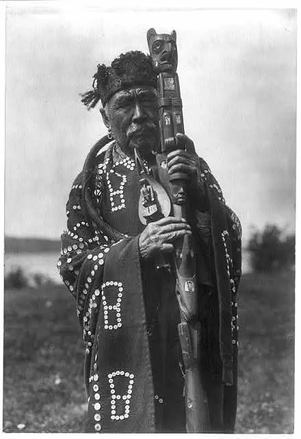 Hamasaka in Tluwulahu costume with speaker's staff--Qagyuhl…, British Columbia, 1914