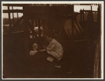 Quentin Roosevelt feeding the rabbits, Oyster Bay, New York, 1904