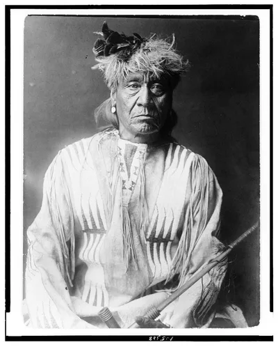 [Atsina Indian, Red Whip, half-length portrait, seated, facing front,…, 1908