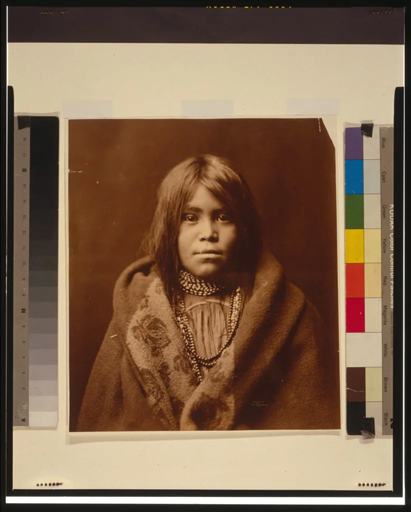 [An Apache girl, head-and-shoulders portrait, facing front, wearing…, 1903