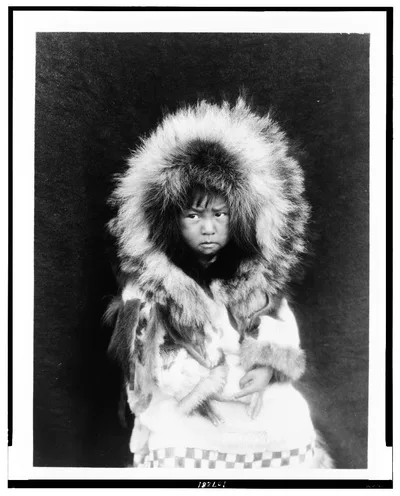 [Noatak child, three-quarter length portrait, seated, facing front], Noatak, Alaska, 1929