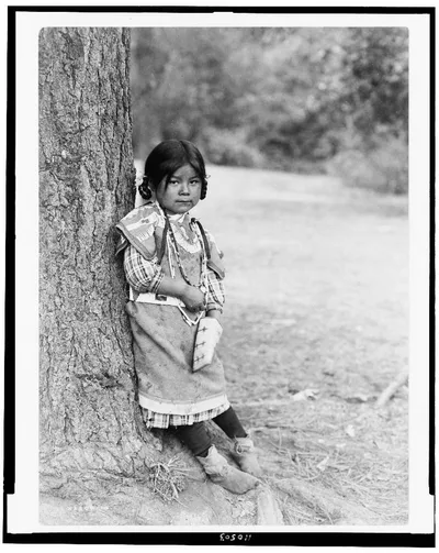 [Innocence, an Umatilla girl, full-length portrait, standing by tree,…, Oregon, 1910