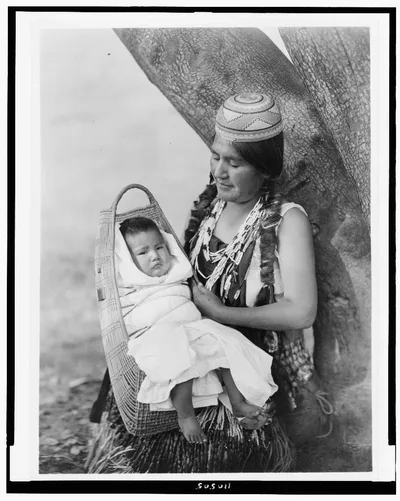 [Hupa mother, three-quarter length portrait, seated, facing left,…, California, 1923