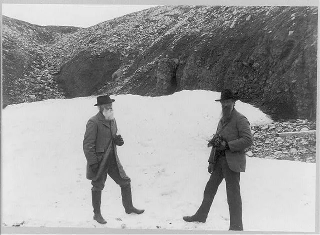 [John Muir and John Burroughs, full-length portrait, standing on snow], 1899