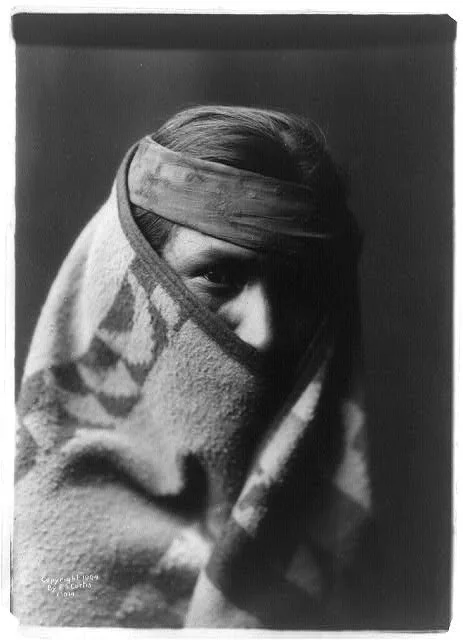 A Navaho [with blanket wrapped around head and shoulders], 1904