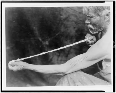Measuring shell money--Tolowa, 1923